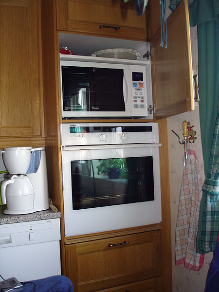 Microwave installed above oven